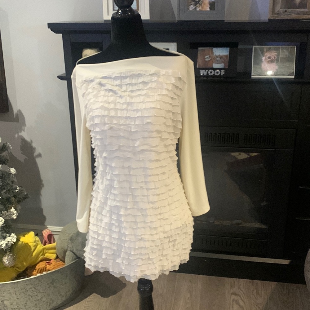 Beautiful blouse with stunning detail.  Wonderful flare sleeves and a boat neck